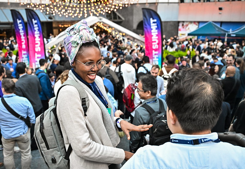 Attendees at Night Summit following opening night at Web Summit Vancouver 2025 at Bentall Centre in Vancouver, Canada
